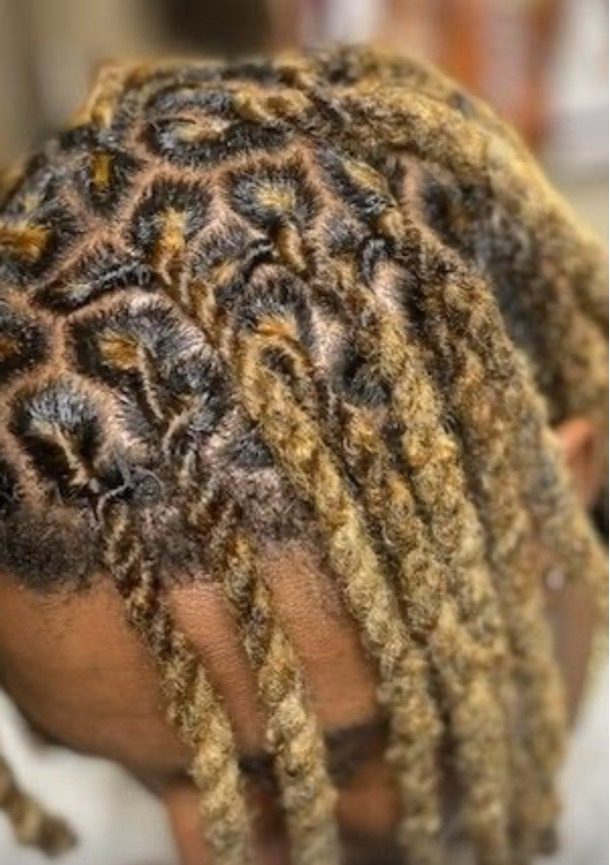 Blonde loc retwist with clean, even parts